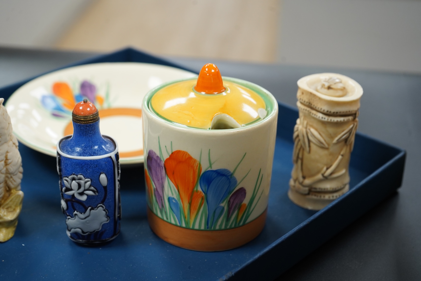 A collection of mixed porcelain and pottery to include four Worcester vases, one signed H. Blake, Clarice Cliff crocus pattern cup, saucer and sugar bowl and two Doulton Imari paperweights, largest 13cm high
